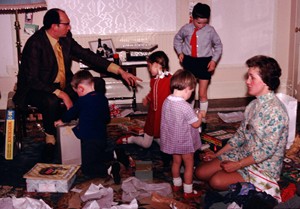 Opening presents on Christmas morning in the 1960s