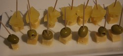 Cheese and olives and cheese and pineapple on sticks